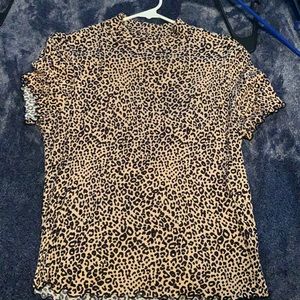 Cheetah print shirt.